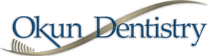 Okun Dentistry logo with blue text and curved design element