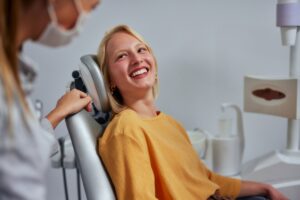 a female dental patients is very happy after received cosmetic dental treatments in Tempe